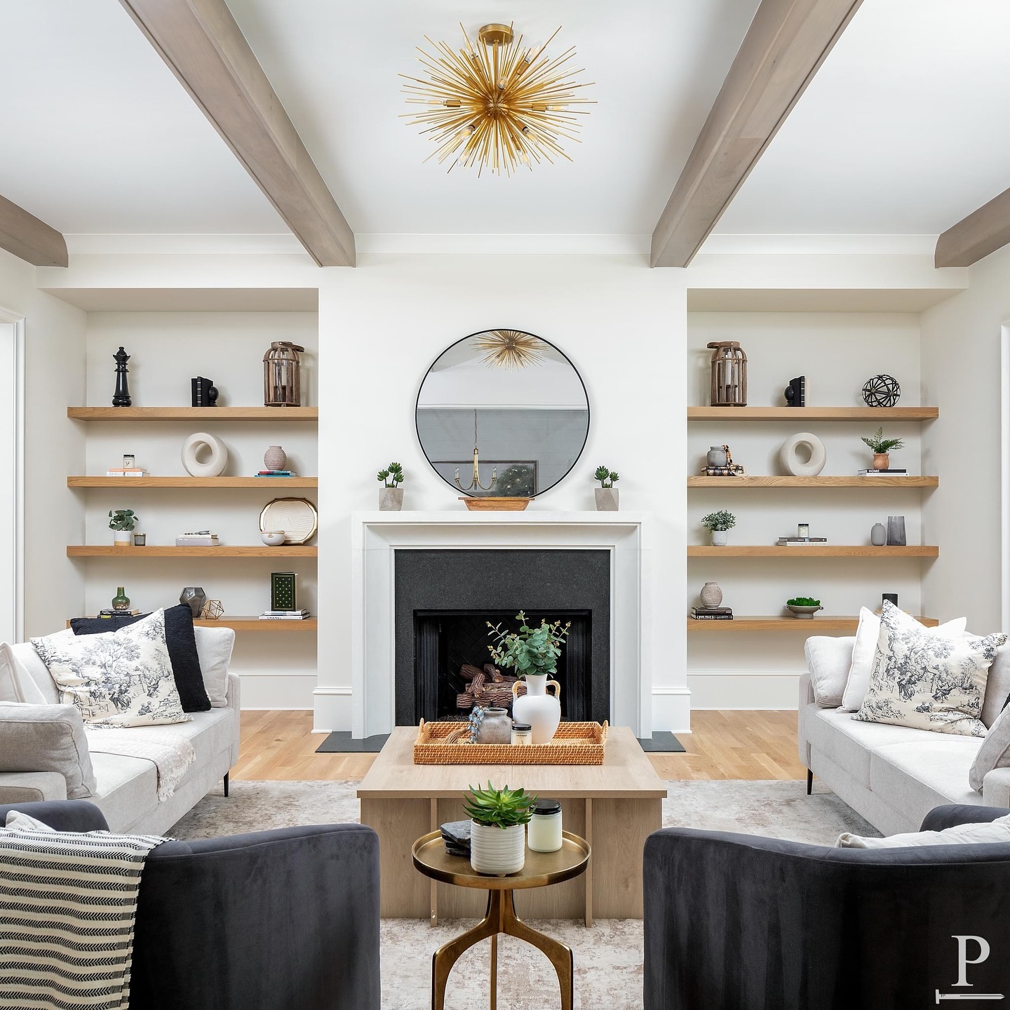 Cozy vibes in this living room with a stunning @visualcomfort  light fixture, sleek white oak built-ins, and rustic beams ✨🏡

#pikeproperties 
•
•
⚒️ @pikeproperties
📸 @joepurvisphotos