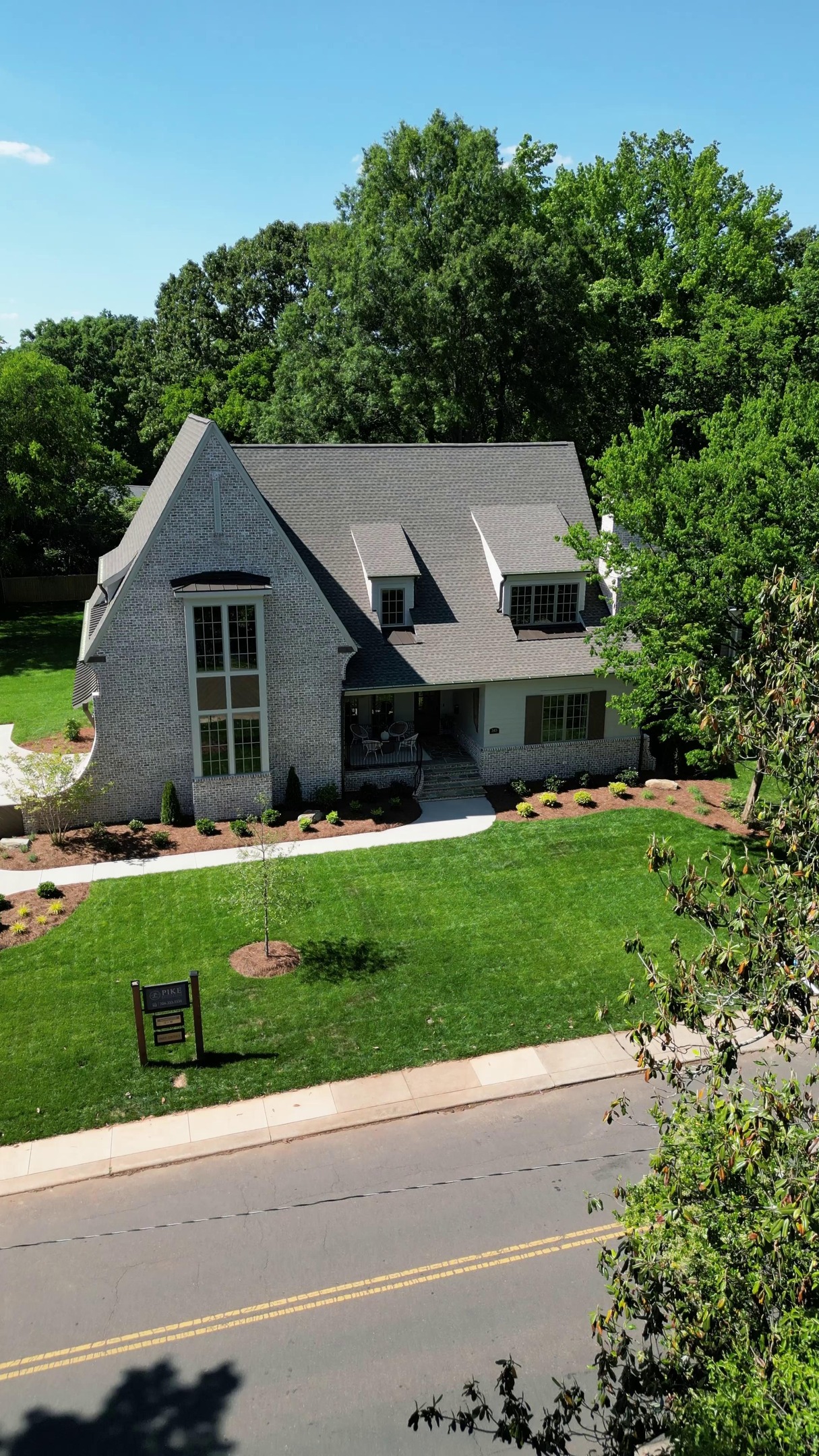 Meet the Kenmore. 🏡✨

4 beds, 5 baths, a dedicated home office, bonus room, and scullery—all wrapped in classic brick with elegant curves that make this exterior unforgettable. 💛