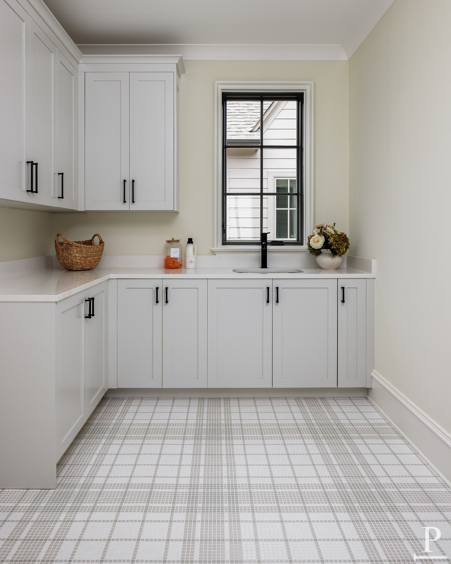 Elevated, effortless, and designed for real life ✨ Soft grays, plenty of storage, and a seamless connection to the primary closet make laundry day just a little easier.