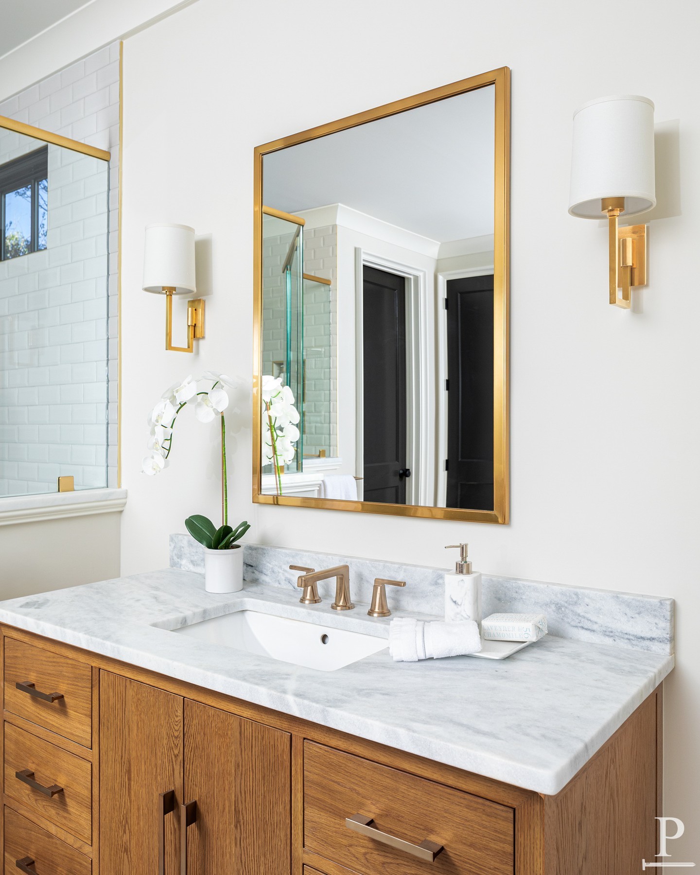 The Allston plan doing what it does best. Beveled subway tile, a patterned mosaic shower floor, built-in brass niches, and a ceiling-mounted rain head. Every finish in this primary bath was chosen to earn its place 🌟