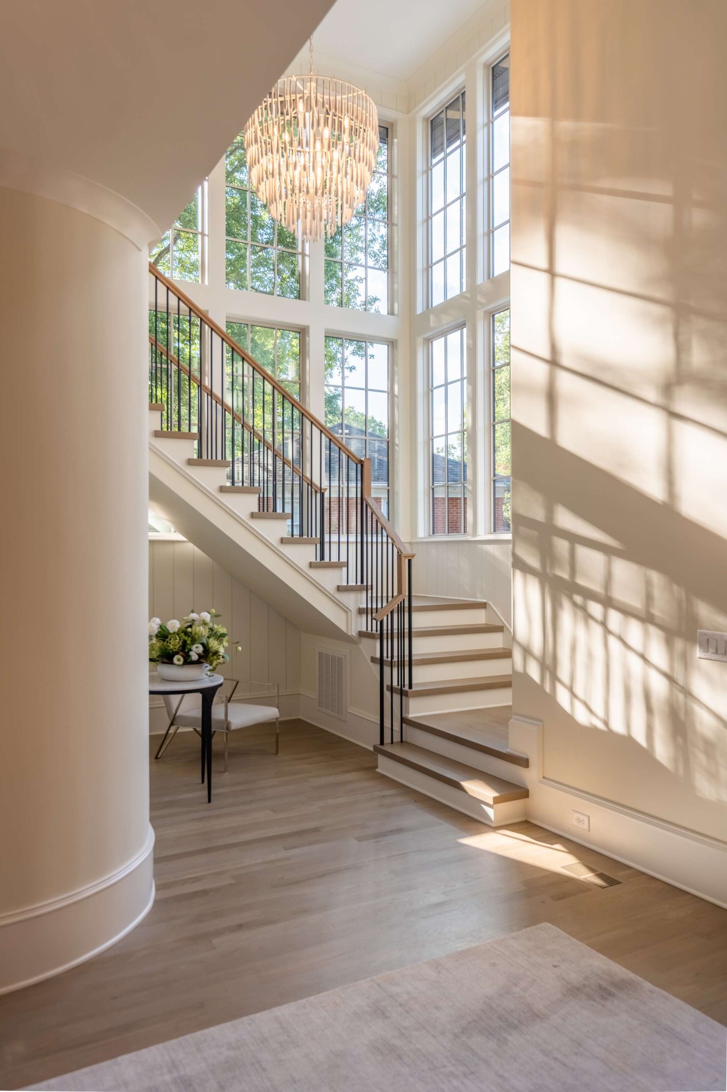 Light finds its way into every corner of this stairwell. 🌿

Floor-to-ceiling windows, a soft oak railing, and a chandelier that sets the tone the moment you walk in.
Interested in touring 5555 Lansing Dr? Reach out to us.
