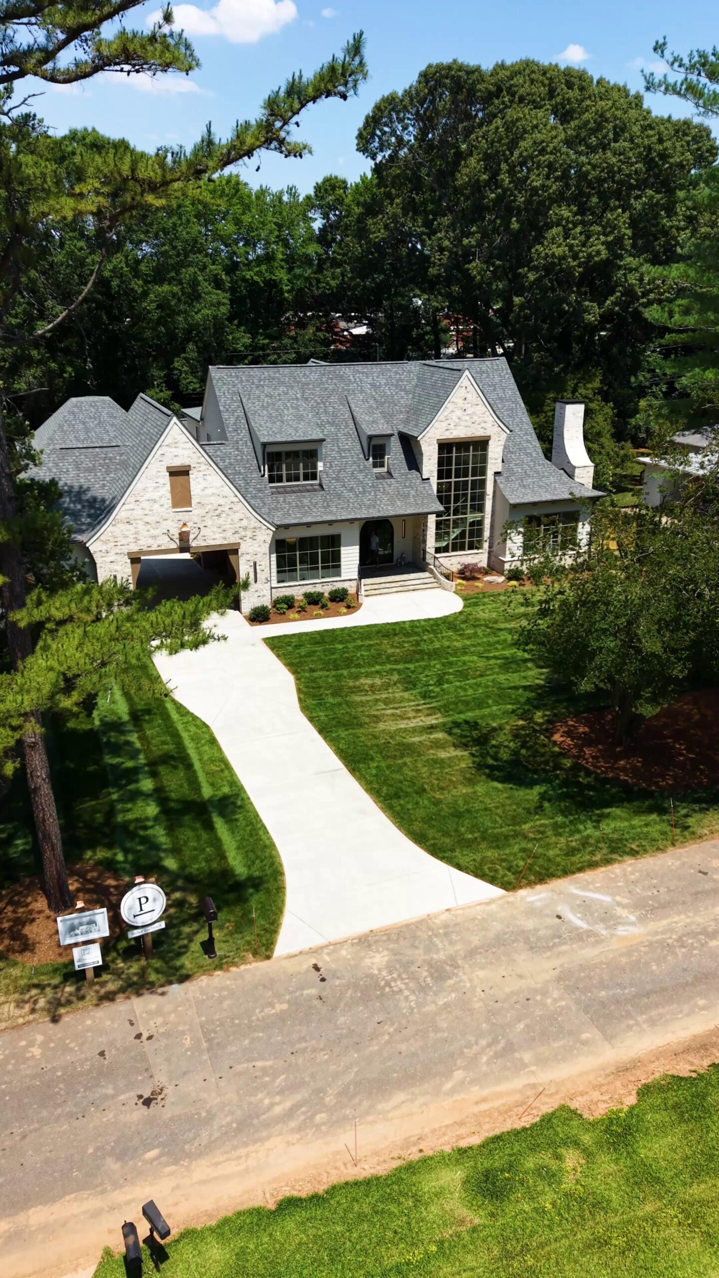 Our Highland plan deserves to be shown from every angle, even the sky. ☁️

The porte cochère might be our favorite feature here. Would you add one to your home?
