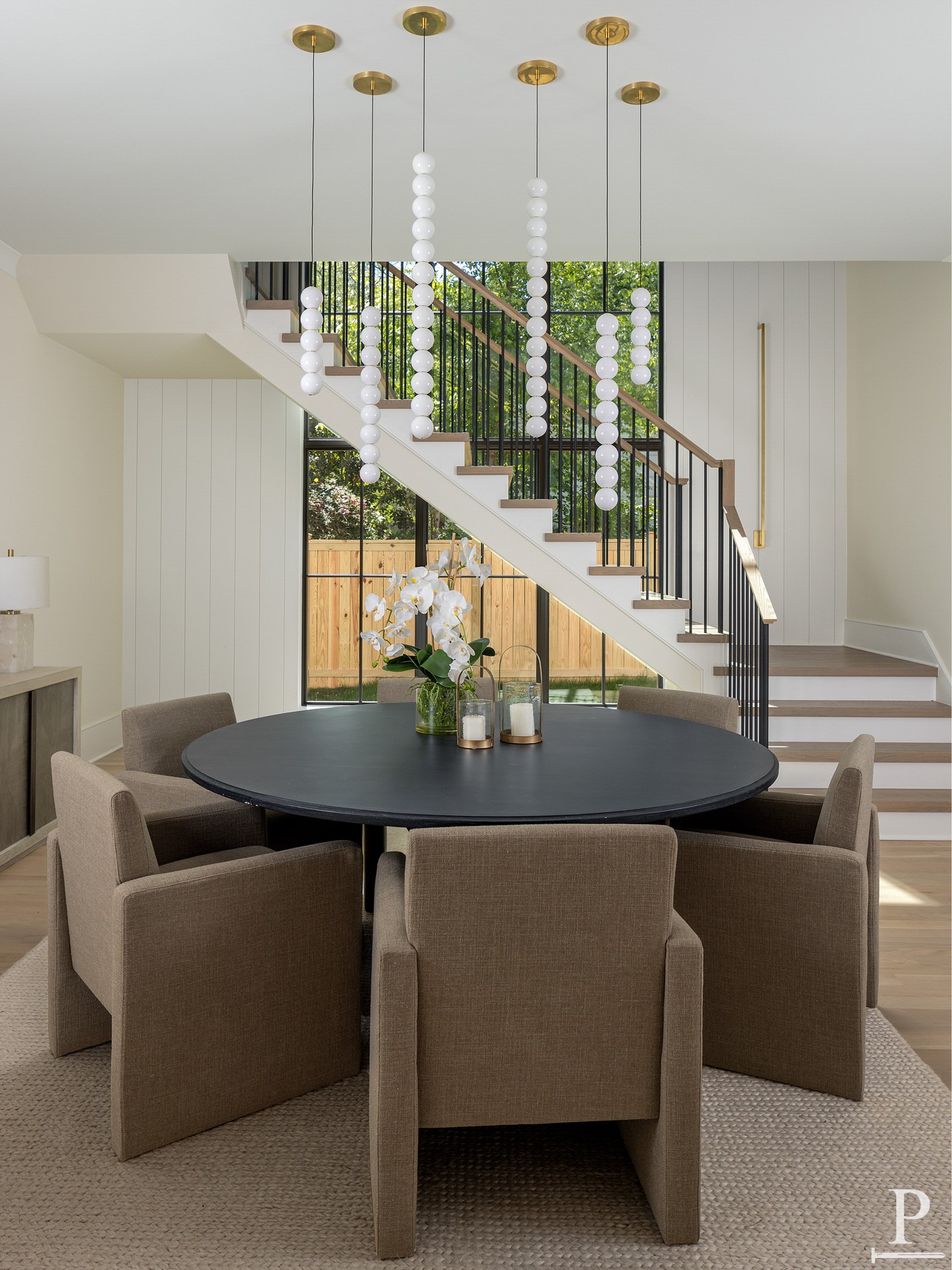 Light pours in and never stops moving through this dining space. A wall of windows keeps the outdoors close, while the room around it stays calm and grounded, made for slowing down over a long meal. ✨

Interested in touring 4110 Melchor Ave? Reach out to us.
