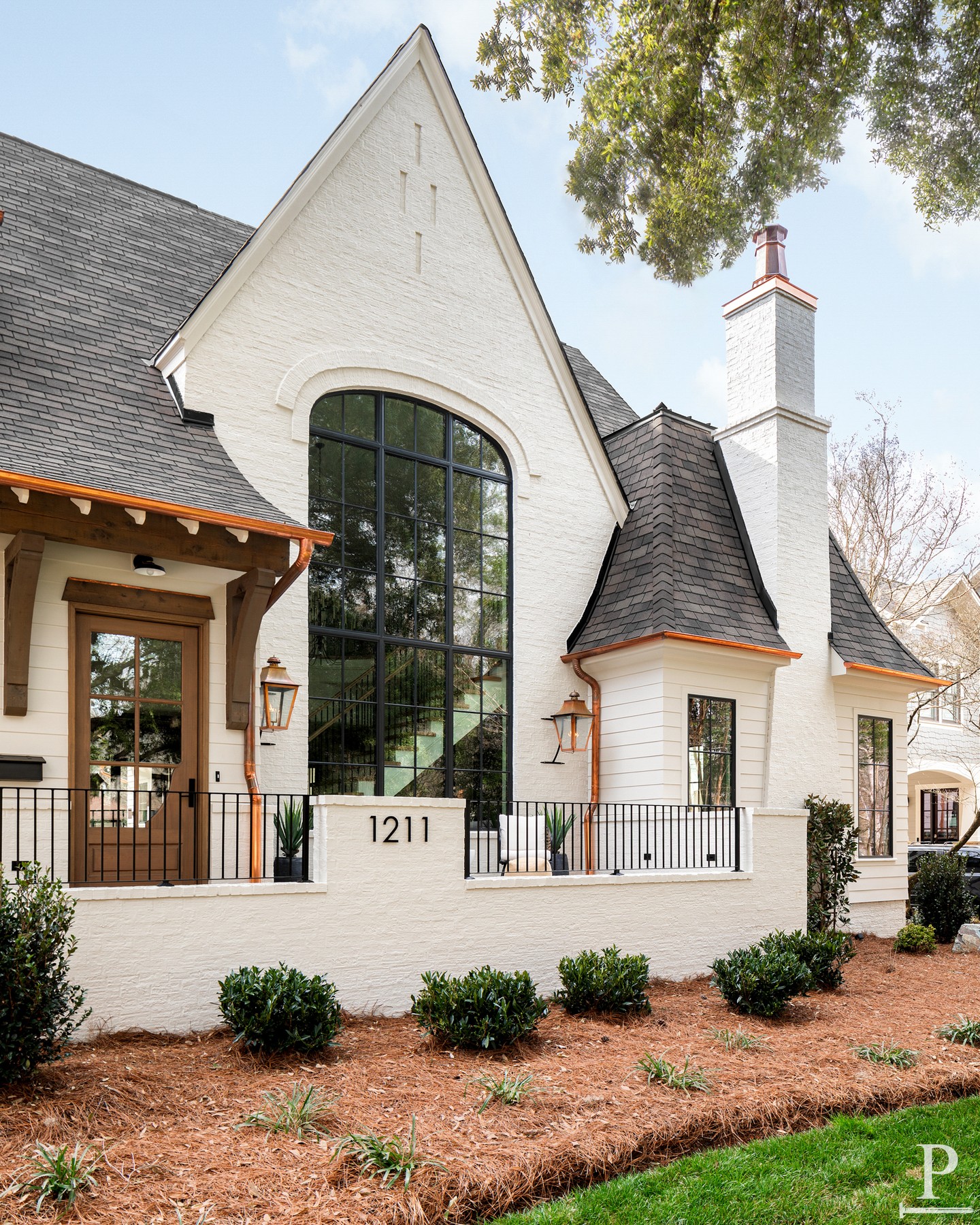 The Sutherland. Copper gutters, copper lanterns, and windows built to catch the morning light.

Painted in Benjamin Moore Olympic Mountains, with a front porch made for slowing down.

Reach out to learn more about the Sutherland plan.
