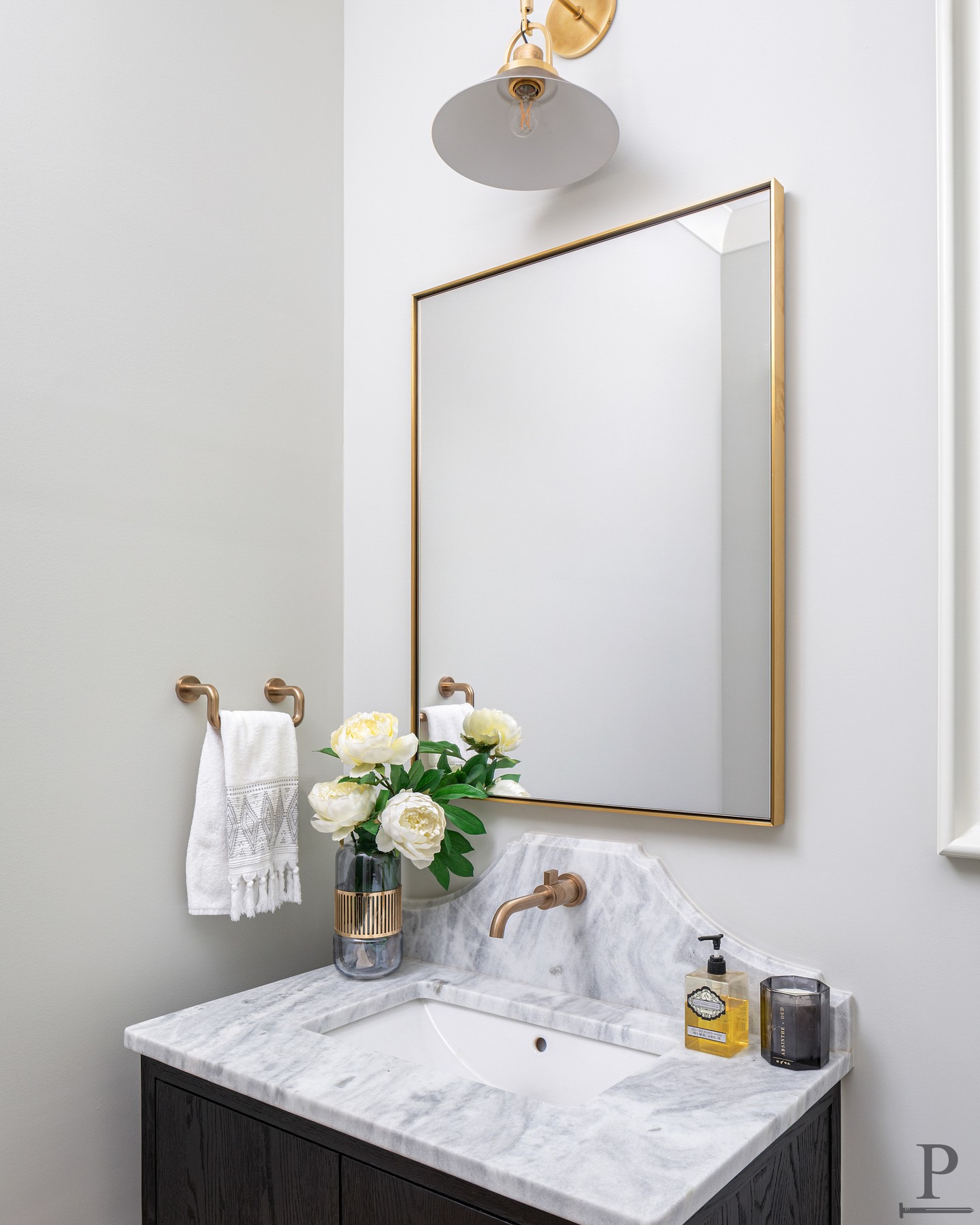 A powder bath is the perfect place to add a little personality to your home. ✨

Custom marble carried up the wall gives this one just the right dose.