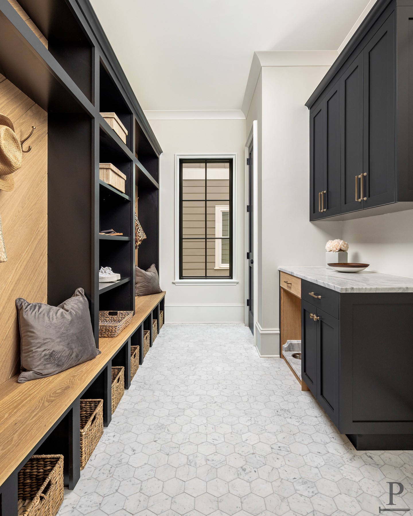 Every good mudroom starts with a plan for the chaos. 🐾

Cubbies for shoes, hooks for bags, and a built-in feeding station complete with its own pot-filler, all tucked into one space that never feels cluttered.