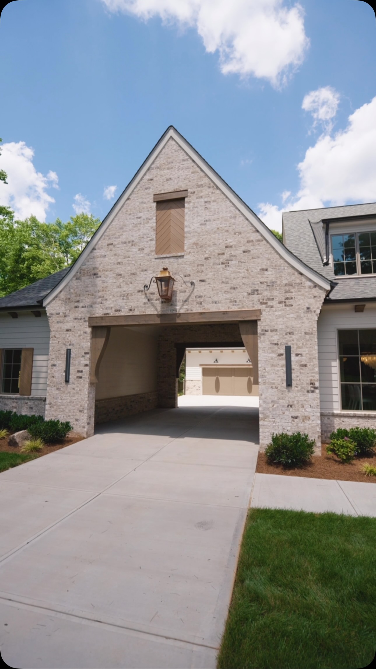 The porte cochère on the Highland plan isn’t just a design statement, it’s doing real work. 

It made room for a third garage bay, created a dedicated friends’ entrance, and freed up the driveway for everything from basketball to just hanging out. 

Form and function working together. 

Reach out to us to learn more about our home plans.