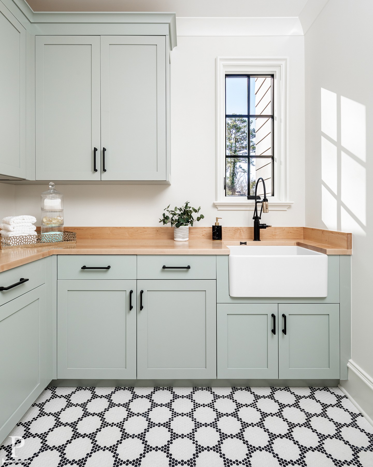 Laundry, made effortless. This room features custom cabinetry in Benjamin Moore Misted Green, a butcher block counter, and a farmhouse sink, but the real detail is the pass through to the primary bedroom, so the cart rolls straight in without ever crossing the hall.

Small design choices like this are what make a home feel truly considered.
