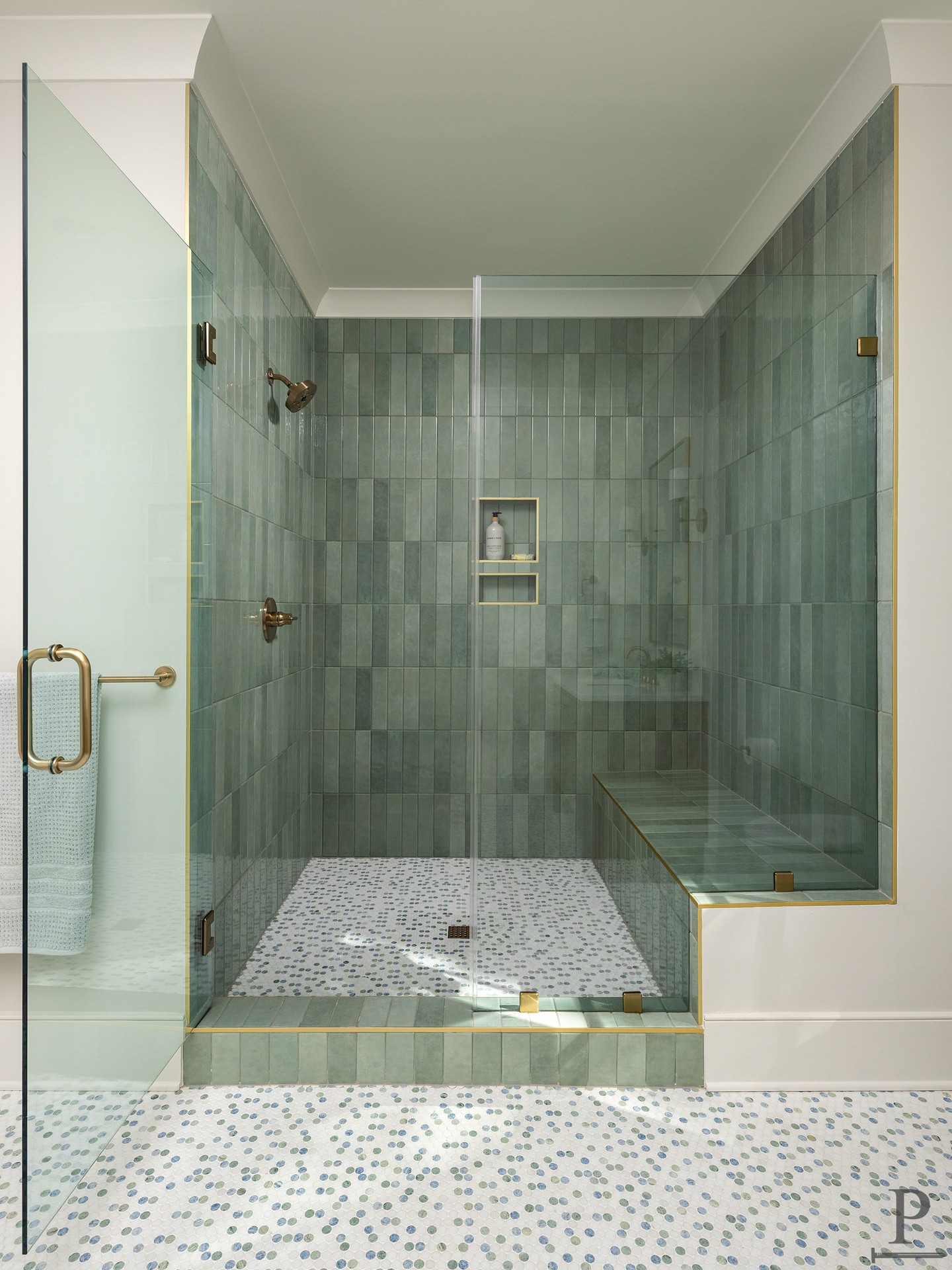 Green tile, brass trim, and a shower you might not want to leave. This is what happens when we don't hold back on the details. ✨